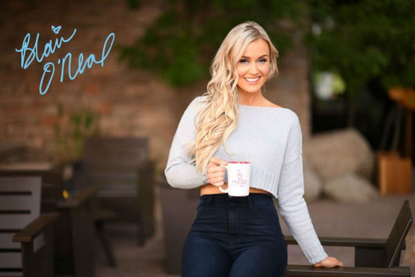 Signature card - Blair O'Neal with a cup a coffee